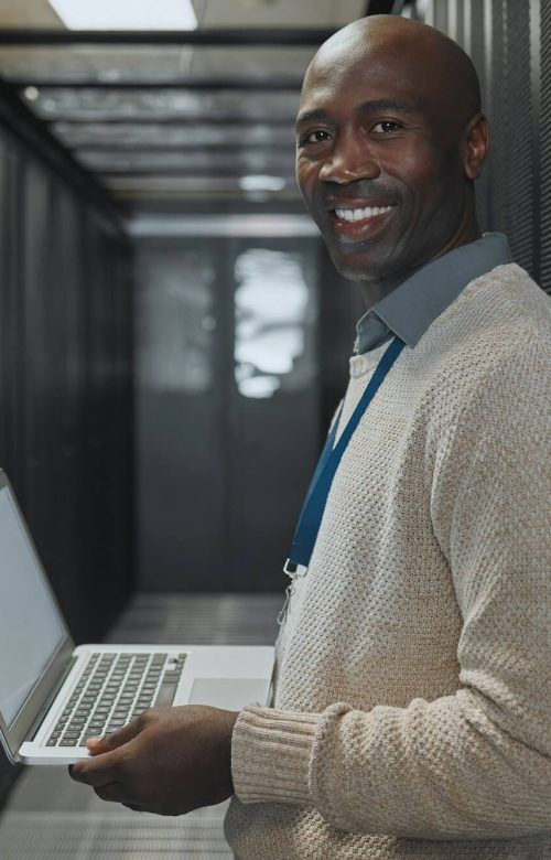 server-room-laptop-and-man-portrait-or-technician-for-data-center-system-and-cybersecurity-code-.jpg